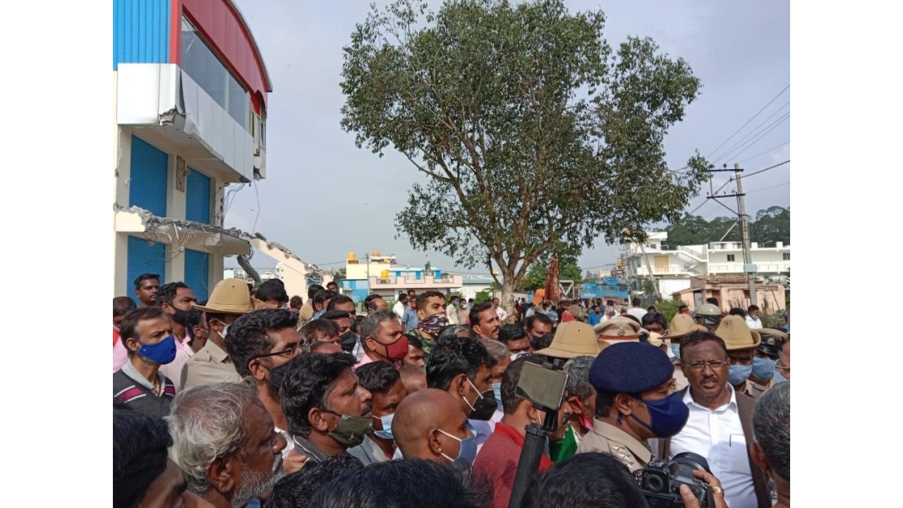 Local residents gathered during the demolition drive on Monday. 