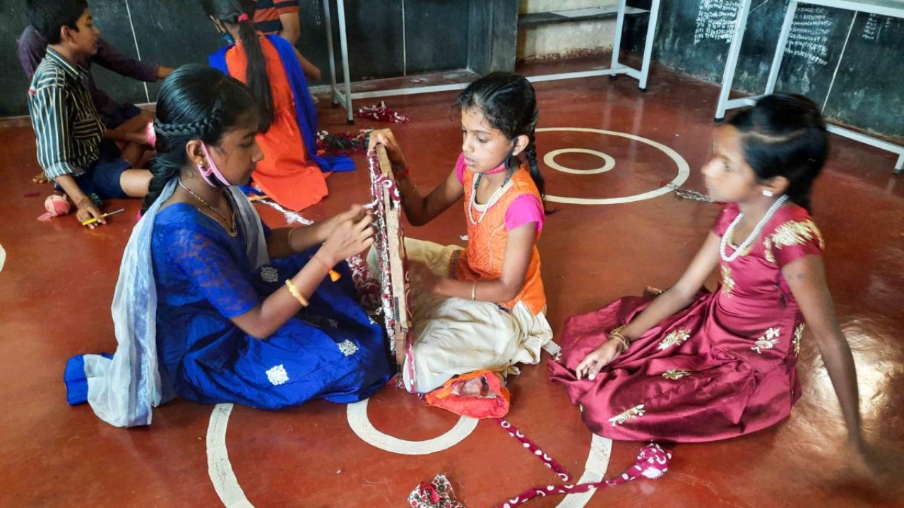 Students of Dakshina Kannada Zilla Panchayat Model Higher Primary School at Moodambailu in Bantwal taluk engaged in making mats using old clothes.