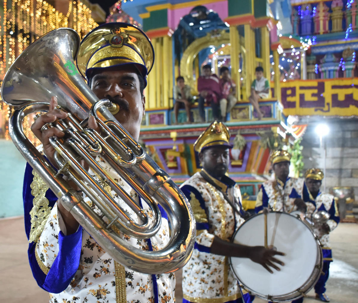 Damaru, bells and khanjara are used in pujas and songs sung in Thigalari (a mix of Tamil and Kannada) and puranas read in Telugu. Live bands can be sighted during processions.