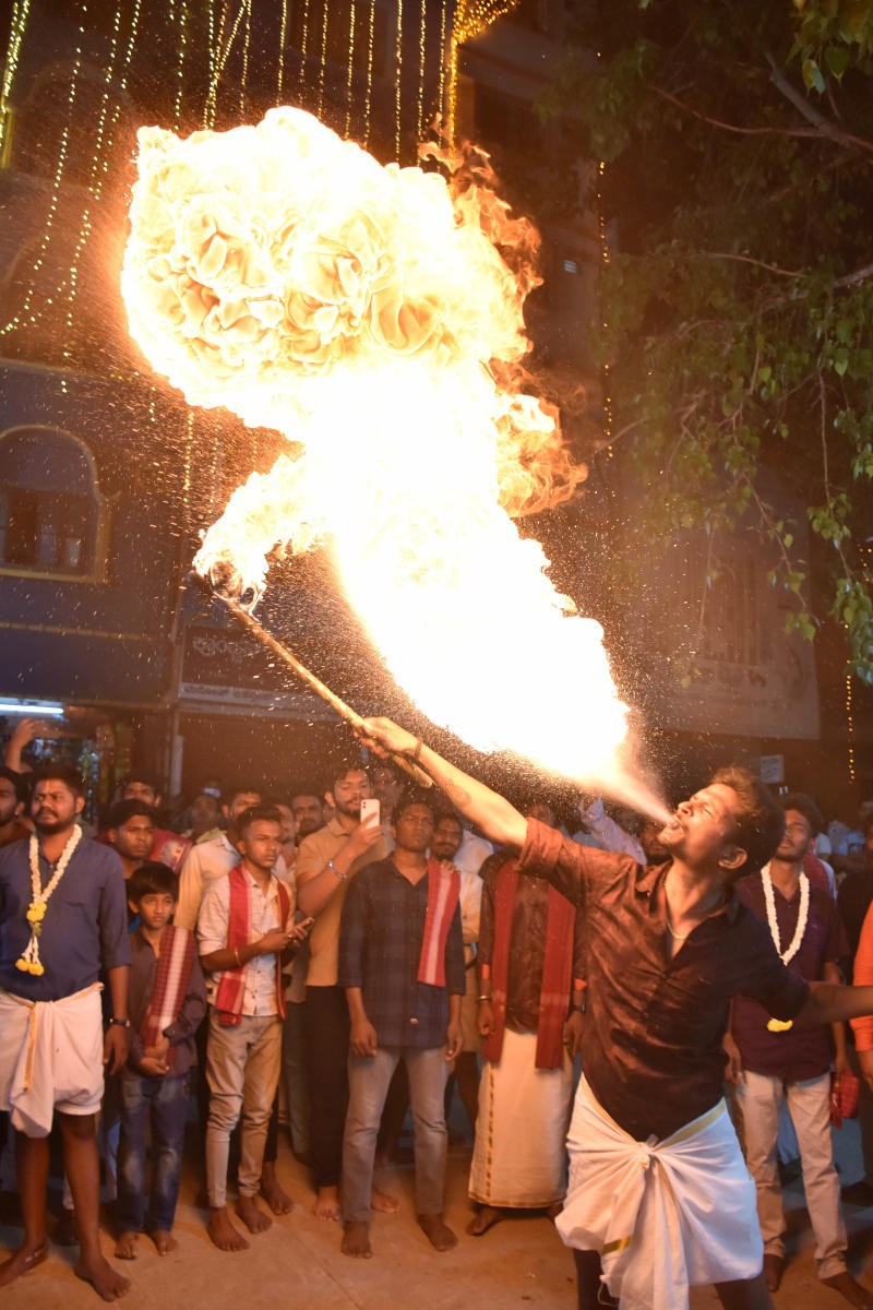 Young members of the Thigala community take part in sword-wielding, fire-eating and stick-fighting as a display of valour.