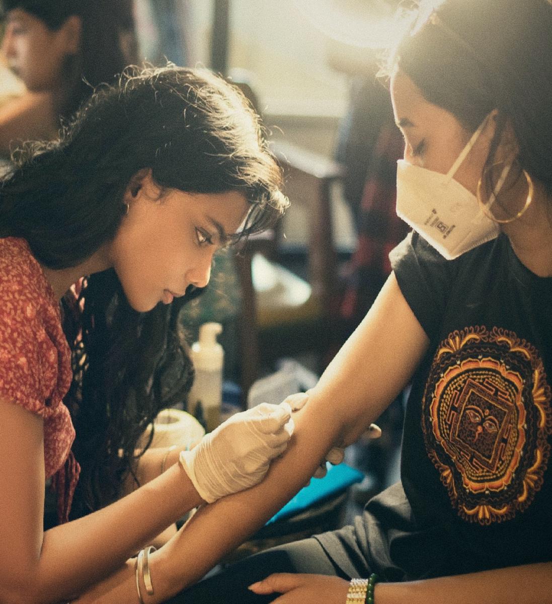 Ishra Philipose, a Bengaluru-based tattoo artist, believes that the hand-poked style has a DIY quality to it. (Right) A design by Ishra, inspired from a cave painting.