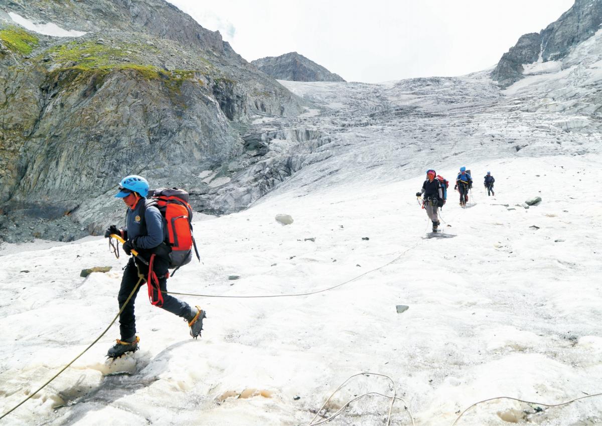 An image of the group scaling Mount Kolahoi.