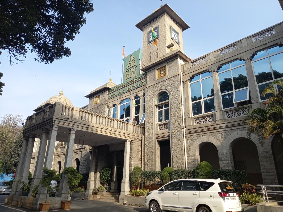 The entrance of the BBMP building, featuring a clock tower.