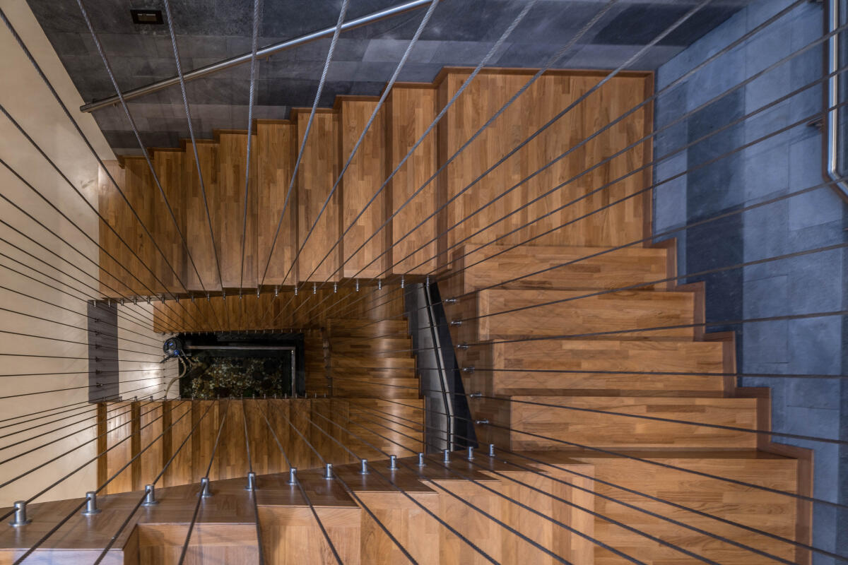Hyderabad-based Urban Zen designed this caged stairway with a koi pond in the centre.