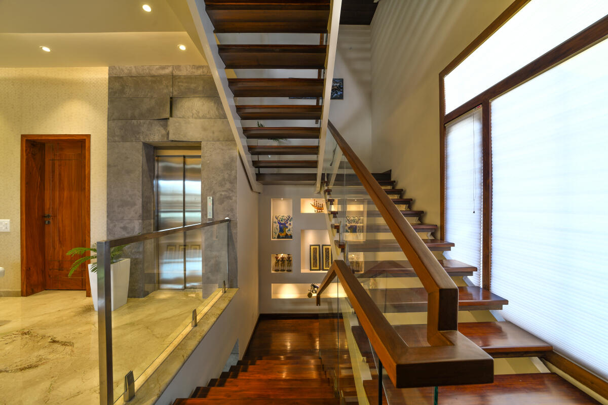 A stairway design by A360 Architects, Bengaluru. The mid-landing features wall niches to display art.