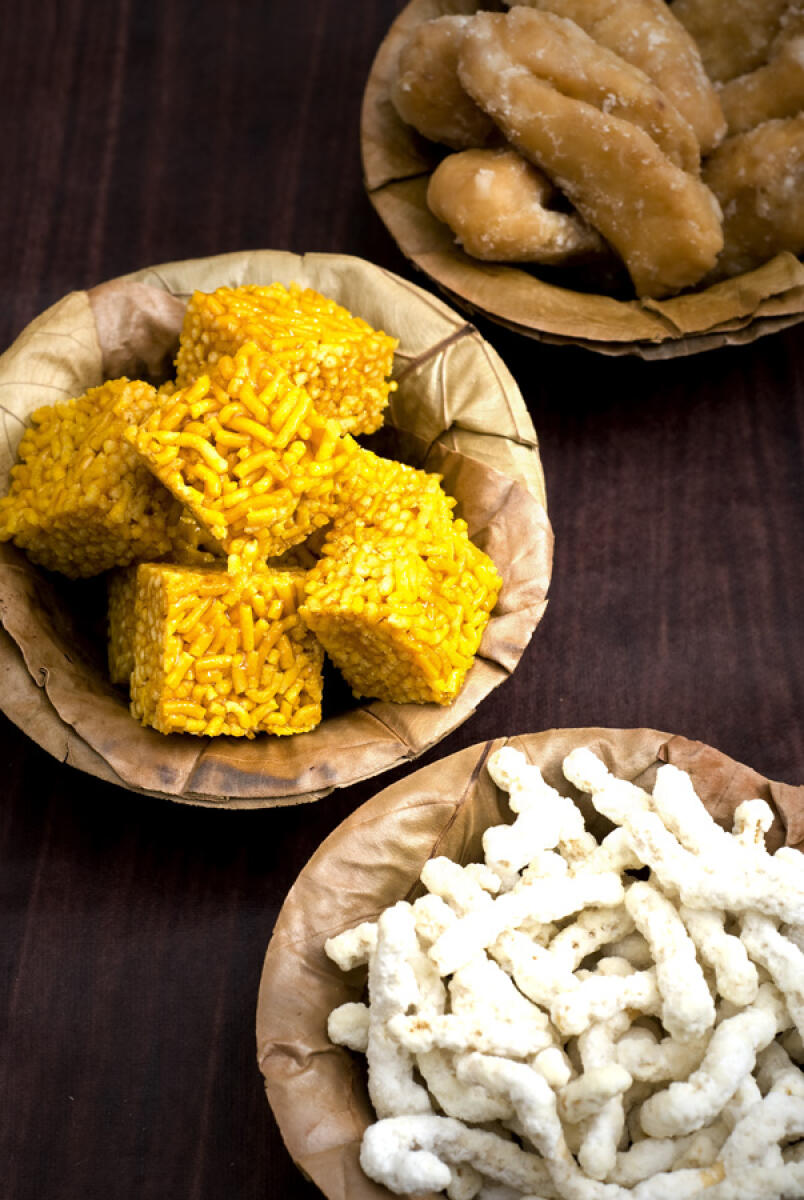 Gur-jo-singar (sev chikki), Tosho (sweet flour rolls) and Nakul (sugar coated sev). PHOTO COURTESY NEHA LULLA
