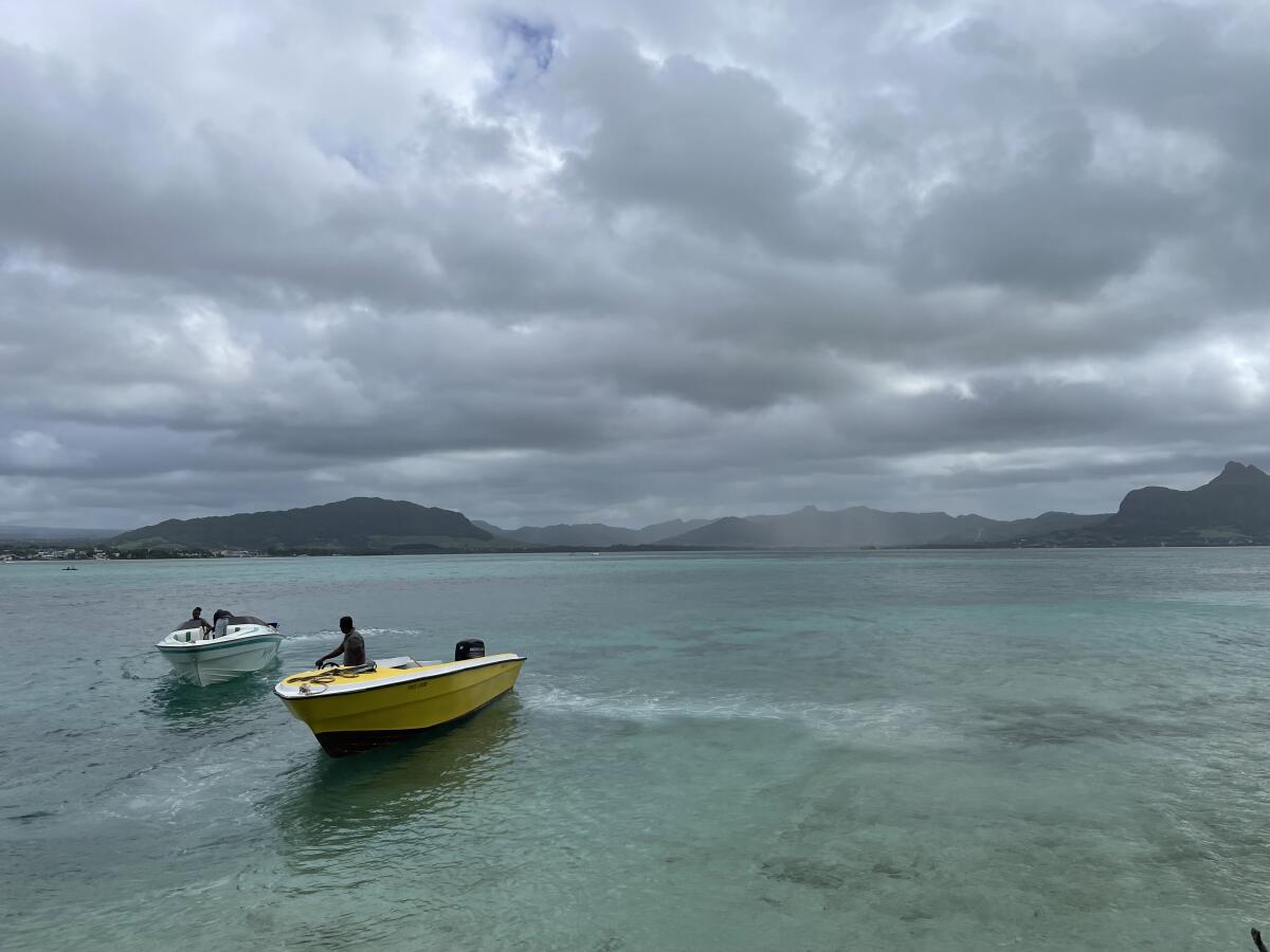 Boatmen anticipate an impending storm.