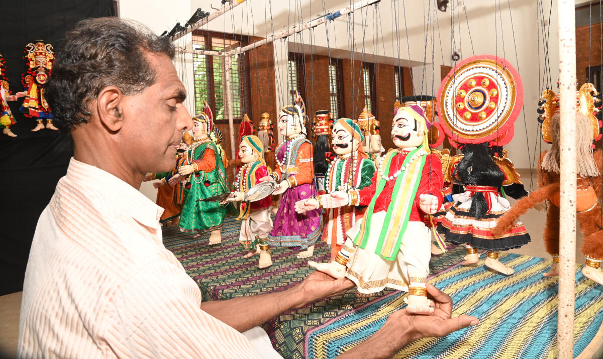 K V Ramesh with the Yakshagana puppets at his residence in Kasargod. DH Photos by Fakruddin H