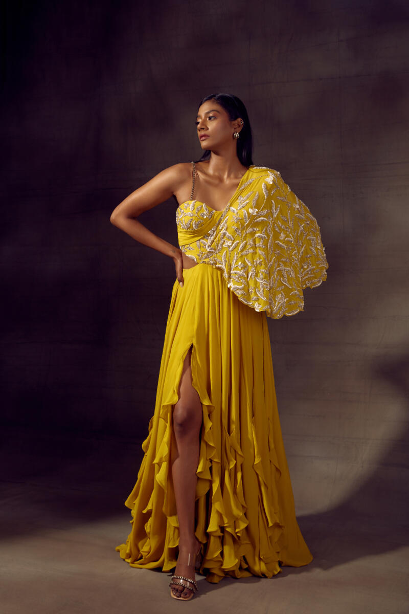 A yellow ensemble with pearls and sequins by Shloka Khialani.