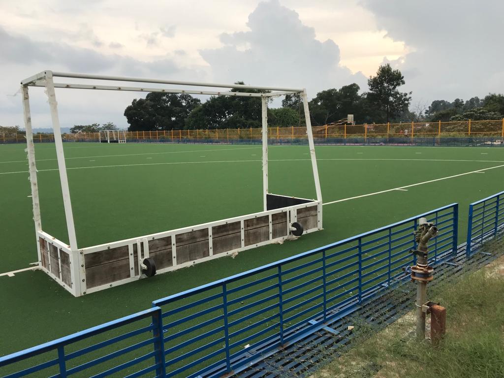 A sprinkler to water the pitch that was wrongly placed behind one of the two goal posts at the hockey arena in Somvarpet. Credit: DH Photo
