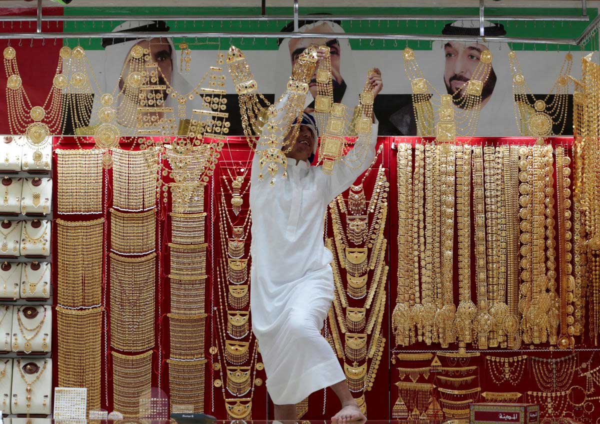 An employee arranges jewellery in a shop at the Gold Souq in Dubai, United Arab Emirates. Reuters Photo