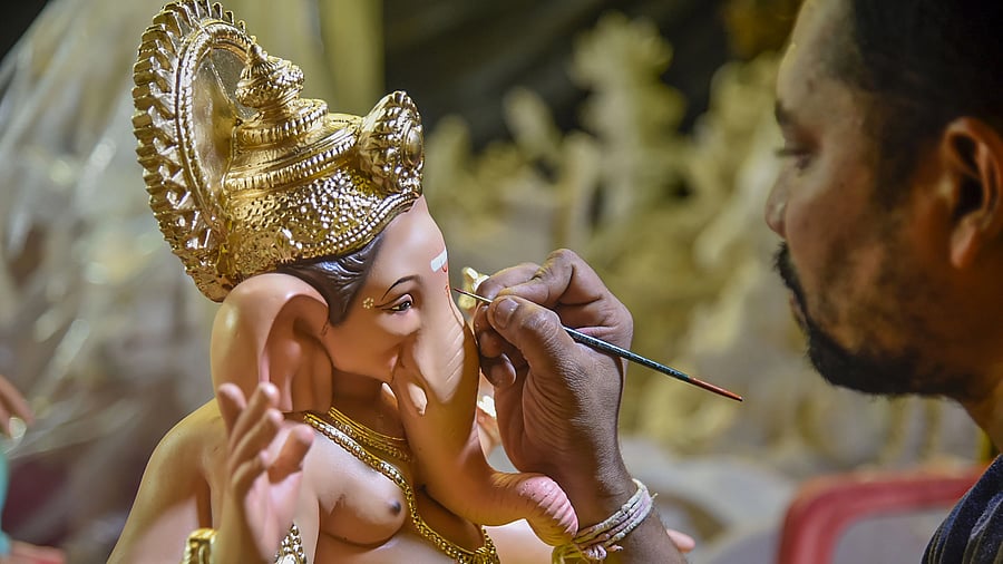 <div class="paragraphs"><p>An artist gives final touches to an idol of Lord Ganesha ahead of Ganesh Chaturthi festival. </p></div>