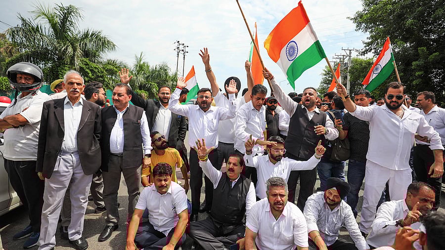 <div class="paragraphs"><p>Members of Jammu Bar Association stage a protest during a 'bandh' called by the Chamber of Commerce and Industries, Jammu, against the installation of smart meters and the Sarore toll plaza, in Jammu, Saturday.</p></div>