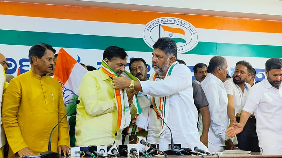 Karnataka Pradesh Congress Committee president D K Shivakumar welcomes former MP Ayanur Manjunath into the Congress at a programme at the KPCC office in Bengaluru on Thursday.