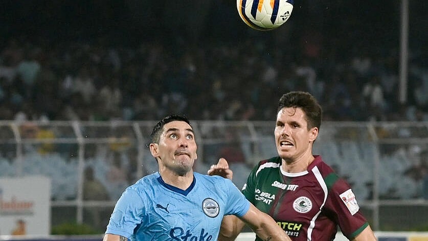 <div class="paragraphs"><p>Mumbai City FC player Jorge Roland Pereyra Diaz (L) with Mohun Bagan Super Giant player vie for the ball during the 4th Quarter Final of Durand Cup 2023, at Vivekananda Yuba Bharati Krirangan, in Kolkata, Sunday, Aug 27, 2023.</p></div>