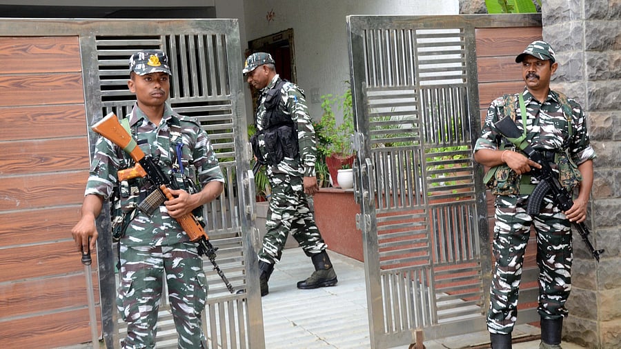 <div class="paragraphs"><p>Ranchi: Security personnel stand guard during an ED raid at a property of Yogendra Tiwary, a close aide of Jharkhand Minister Rameshwar Oraon's son Rohit Oraon, in Ranchi, Wednesday, Aug. 23, 2023. </p></div>