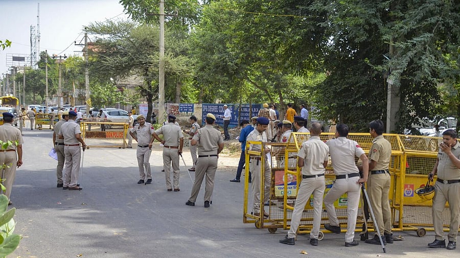 <div class="paragraphs"><p>Police personnel stand guard ahead of a rally of Hindu organisations to be taken out in Nuh, weeks after violence in the region, in Gurugram.&nbsp;</p></div>