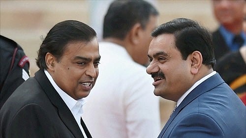 <div class="paragraphs"><p>File photo of Industrilaists Mukesh Ambani (left ) and Gautam Adani at the swearing-in ceremony of the NDA government at Rashtrapati Bhavan in New Delhi. </p></div>