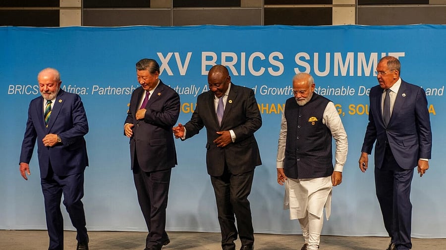 <div class="paragraphs"><p>Brazil's President Luiz Inacio Lula da Silva, China's President Xi Jinping, South African President Cyril Ramaphosa, Indian Prime Minister Narendra Modi and Russia's Foreign Minister Sergei Lavrov walk after posing for a picture at the BRICS Summit. </p></div>