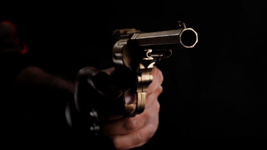 <div class="paragraphs"><p>Representative image of a man holding a handgun.</p></div>