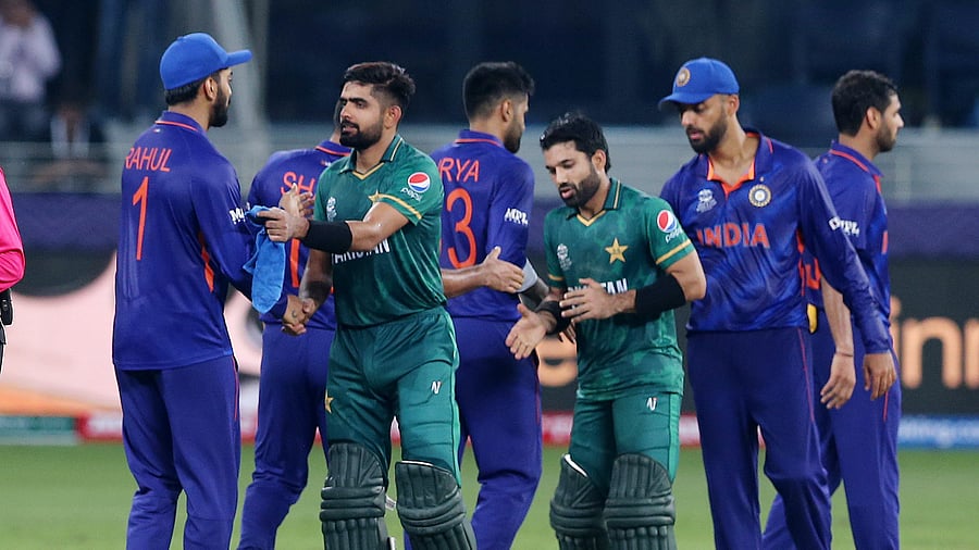 <div class="paragraphs"><p> Pakistan's Mohammad Rizwan and Babar Azam shake hands with the Indian players after the match.</p></div>