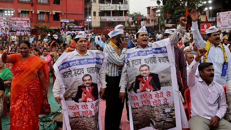 <div class="paragraphs"><p>People shout slogans as they wear banners during a protest against the redevelopment of Dharavi.</p></div>