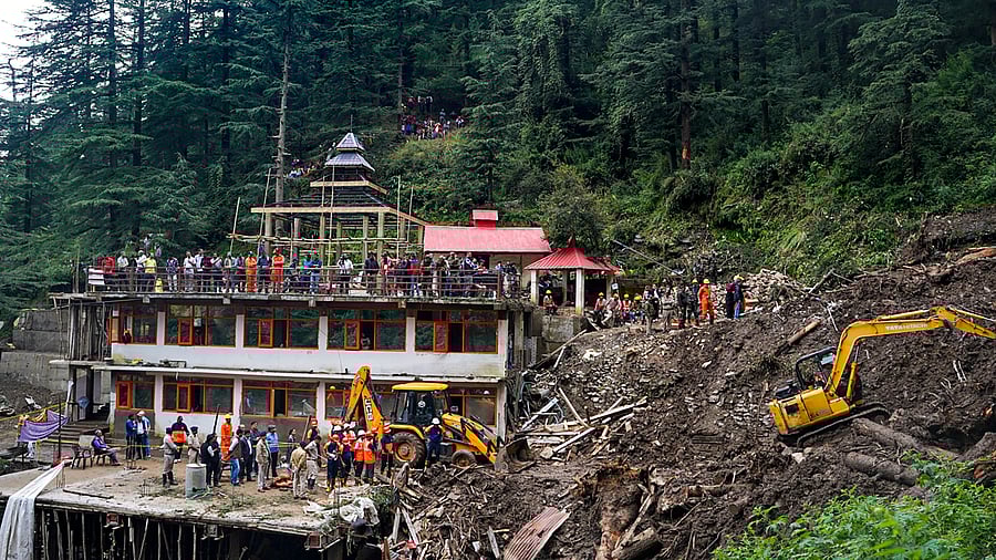 <div class="paragraphs"><p>Rescue workers remove debris during search operation for survivors after a landslide following torrential rain, in Shimla.</p></div>