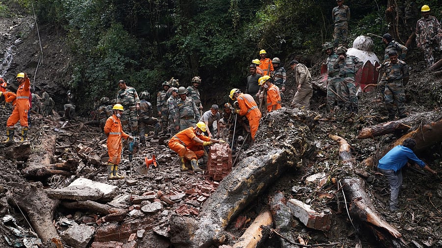 <div class="paragraphs"><p>Rescue workers remove the debris as a search operation continues in the aftermath of a landslide following torrential rain in Shimla in the northern state of Himachal Pradesh, India, August 17, 2023. </p></div>