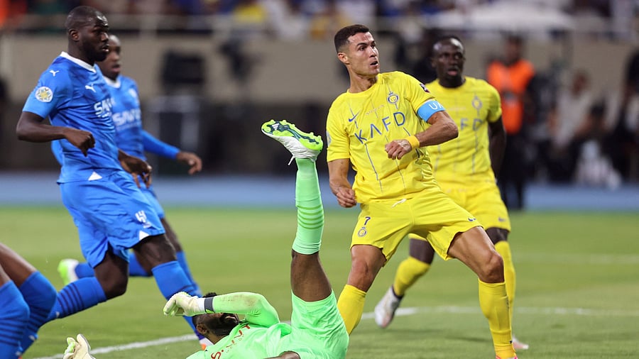 <div class="paragraphs"><p>Al Nassr's Cristiano Ronaldo scores their first goal during the Arab Club Champions Cup final. </p></div>