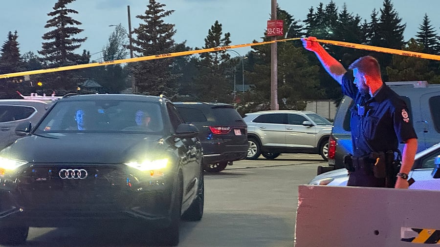 <div class="paragraphs"><p>A police officer holds up crime scene tape to allow people to leave after a shooting incident at the West Edmonton Mall in Edmonton, Alberta, Canada August 21, 2023.  </p></div>