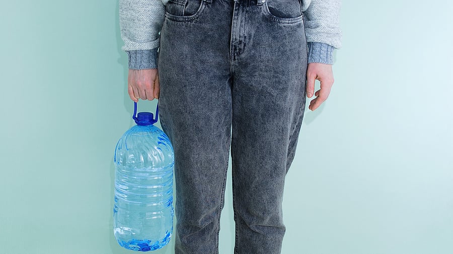 <div class="paragraphs"><p>Representative image showing a person carrying a large jar of water.</p></div>
