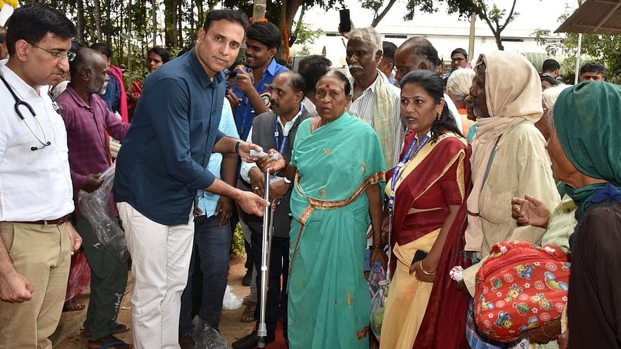 <div class="paragraphs"><p>Former India cricketer VVS Laxman distributes walking sticks to the elderly as part of the golden jubilee celebrations of the Village Clinic. </p></div>