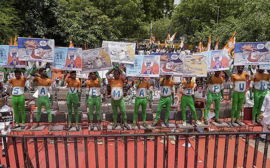 <div class="paragraphs"><p>New Delhi: Indian Youth Congress workers holding placards take part in a protest over Manipur violence, inflation, unemployment and other issues, at Jantar Mantar in New Delhi, Tuesday, August 8, 2023. </p></div>