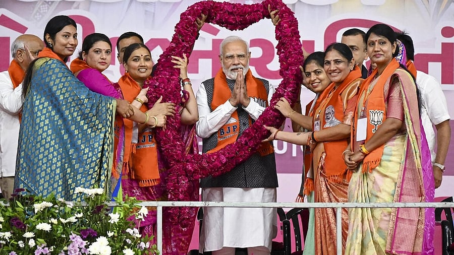 <div class="paragraphs"><p>Prime Minister Narendra Modi being Garlanded during the 'Nari Shakti Vandan - Abhinandan' event, in Ahmedabad.</p><p></p></div>