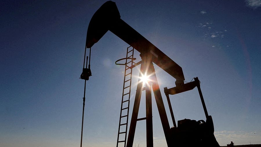 <div class="paragraphs"><p>The sun is seen behind a crude oil pump jack.</p></div>