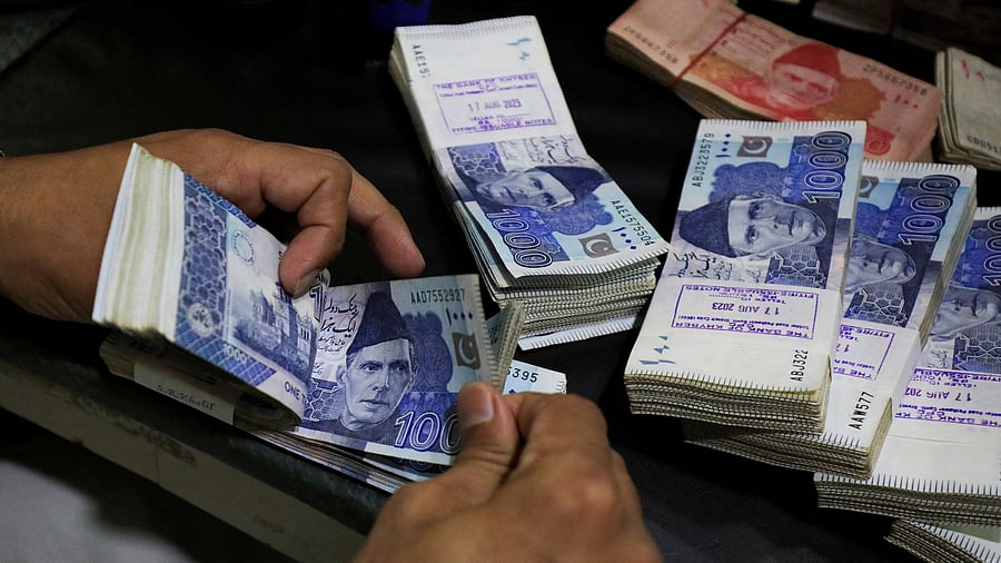 <div class="paragraphs"><p>  Pakistani rupee notes.</p></div>