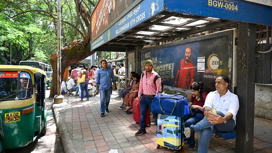 <div class="paragraphs"><p>People with luggage wait for transportation during the ‘Bengaluru Bandh’ protest against Cauvery water release to Tamil Nadu. </p></div>