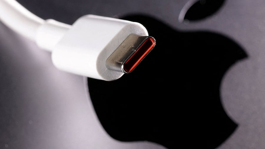 <div class="paragraphs"><p> A USB-C cable is seen near the Apple logo.</p></div>