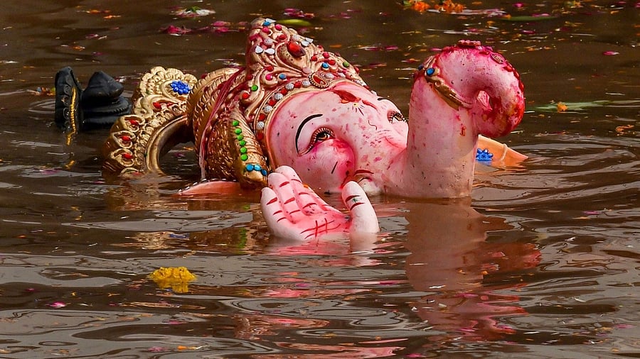 <div class="paragraphs"><p>An idol of Lord Ganesha being immersed.</p></div>