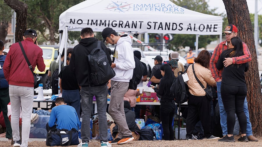 <div class="paragraphs"><p>Migrants gather at primary  border fences between Mexico and the United States.</p></div>