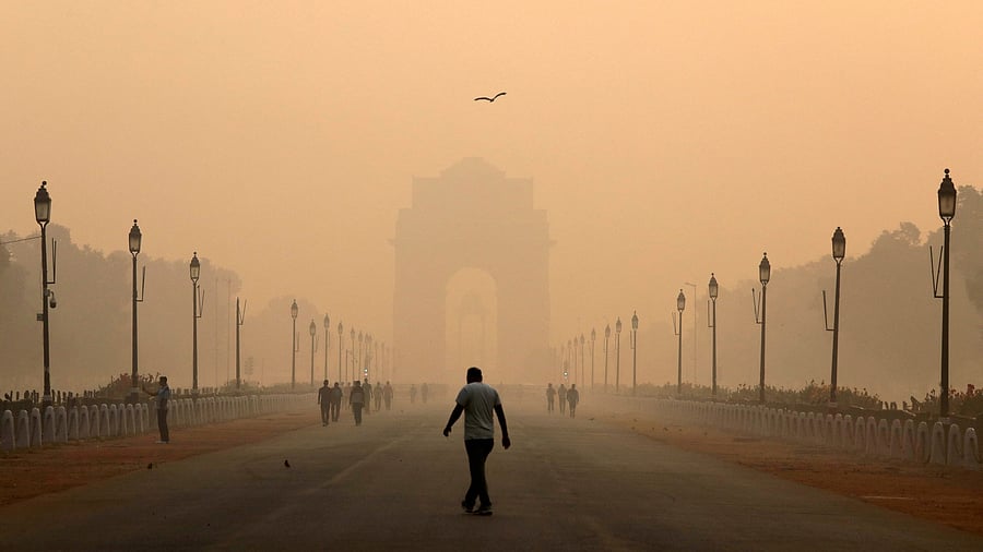<div class="paragraphs"><p>A man walks in front of India Gate shrouded in smog in New Delhi.</p></div>