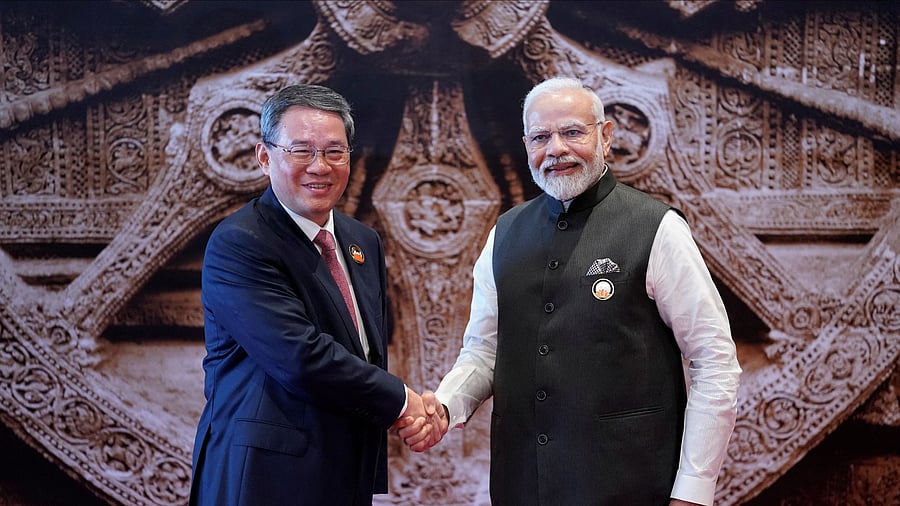 <div class="paragraphs"><p>Indian Prime Minister Narendra Modi shakes hand with Chinese Premier Li Qiang  upon his arrival at Bharat Mandapam convention centre for the G20 Summit in New Delhi.</p></div>