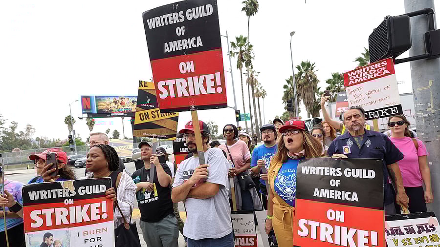 <div class="paragraphs"><p>SAG-AFTRA actors and Writers Guild of America writers walk the picket line during their ongoing strike outside Netflix offices in Los Angeles, California, US, September 22, 2023. </p></div>