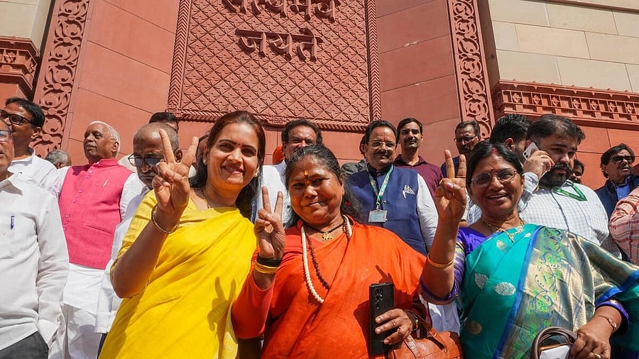 <div class="paragraphs"><p>Union Ministers Bharati Pawar and Sadhvi Niranjan Jyoti and other parliamentarians at the new Parliament building after the Women's reservation Bill was tabled. </p></div>