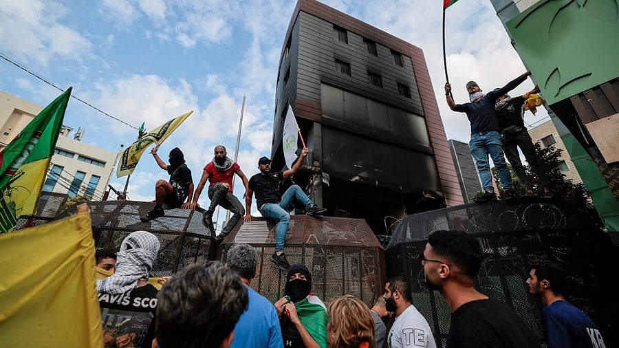 <div class="paragraphs"><p>Lebanese protesters demonstrate with Palestinian flags near the US embassy in a suburb of Beirut.&nbsp;</p></div>