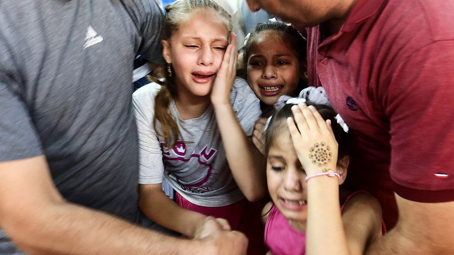 <div class="paragraphs"><p>Children mourn as they attend the funeral of Hamas militants, who were killed by Israeli forces, on the day Hamas launched a surprise attack on Israel, in the northern Gaza Strip.</p></div>