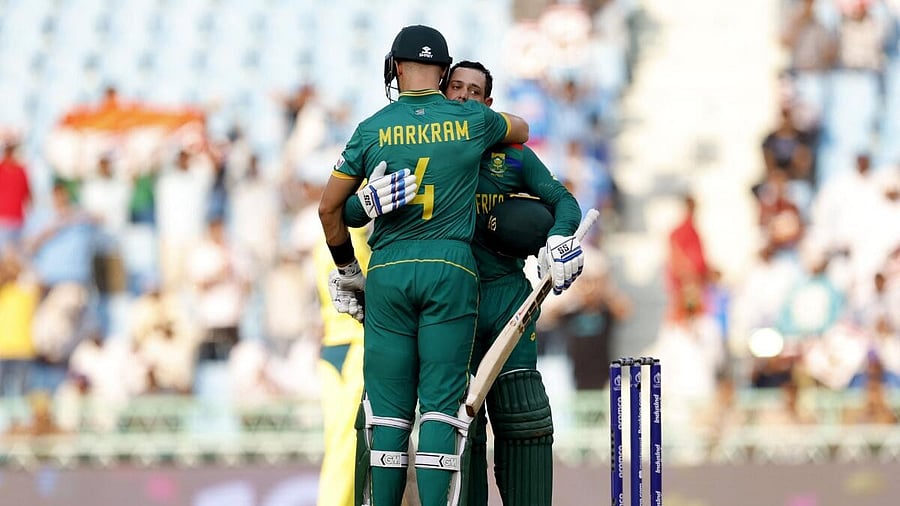 <div class="paragraphs"><p>Quinton de Kock celebrates with Aiden Markram after reaching his century.</p></div>