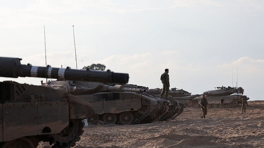 <div class="paragraphs"><p>Israeli tanks are seen in the aftermath of a mass infiltration by Hamas gunmen from the Gaza Strip, in Kibbutz Beeri in southern Israel, October 14, 2023.</p></div>