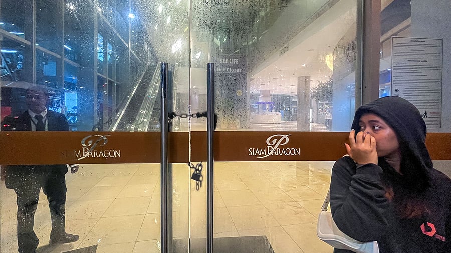 <div class="paragraphs"><p>A security stands guard following shots fired at the luxury Siam Paragon shopping mall, in Bangkok, Thailand.</p></div>