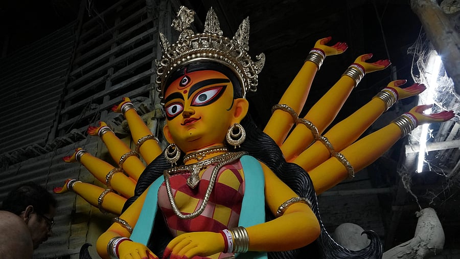 <div class="paragraphs"><p>Kolkata: An artist gives finishing touches to an idol of Goddess Durga at his studio ahead of Durga Puja festival, in Kolkata, Sunday, Oct. 8, 2023.</p></div>